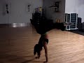 Tara in a handstand split, training for M&F Shoot