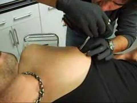 nipple piercing-redwolf tattoo. www.redwolftattoo.com by Ahmet 