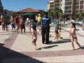 Morgan and Nathan do the limbo at the pool