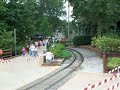 Red train departing tweedside station Busch Gardens Williamsburg Va