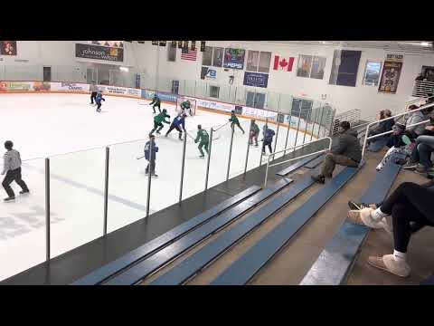 Scoring a beautiful top shelf goal Number 9 in Green with Read Breezers playing center at the CCM high-performance festival in Duluth Minnesota