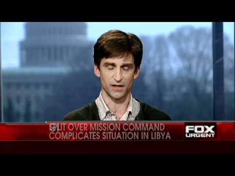 libya split - NATO has agreed to takeover in command of the no-fly zone in Libya, but French President Nicolas Sarkozy doesn't seem too happy about it and says,