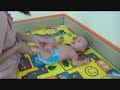 Triplets' first swimming lesson