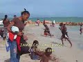 Youths playing football on Hellshire Beach