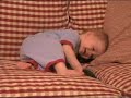 8 month old baby boy laughs when Daddy plays with him.