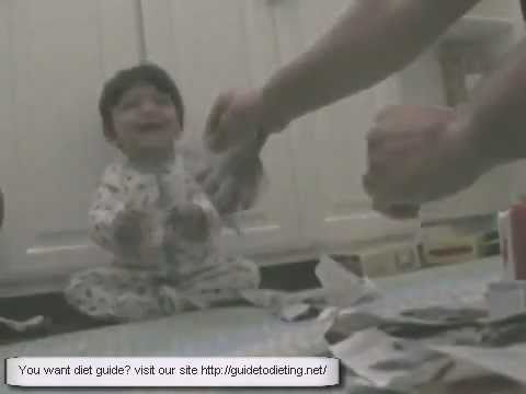 baby laughing at tearing paper baby laughing at tearing paper