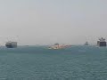 During the quarter of a century that I've lived in Egypt I have always been intrigued to see vessels plying the Suez Canal.  Indeed, the ship convoys often appeared to be floating across the desert as if by magic if I was situated far enough away from the canal at the time of sighting.  So I'm sure no one will be surprised when I admit that I have long wondered how a local resident could sail through the canal.  Unfortunately, I never found an answer to that question.  However, in the autumn of 2004 and again in the spring of 2008 I was able to join two international cruises which included Suez Canal transits.  In November 2004 I sailed south from Alexandria to Mombasa, Kenya on the 10,000-ton, 208-passenger Seabourn Spirit; and in May 2008 I sailed north during an Africa circumnavigation cruise on Holland America Line's 38,000-ton, 793-passenger Prinsendam. The Suez Canal was constructed by forced labor at a cost of USD 100 million over a 10 1/2-year period by Ferdinand de Lesseps' Universal Company for the Suez Maritime Canal, which was formed in 1858.  The canal was opened on November 17, 1869 by the French Empress Eugenie.  163 km (101 miles) long and 600 meters (1,968 feet) wide in its narrowest stretch, the canal links the Mediterranean at Port Said to the Red Sea at Suez.  With an average transit time of 15 hours, the canal saves ships 11,829 km (7,350 miles) compared to the circumnavigation of Africa.The Suez Canal, which has no locks, accommodates about 50 ships daily and is capable of handling up to 80 ships in a single day.  The current maximum draft allowed is 16 meters (53 feet), and modifications now underway should increase this to 22 meters (72 feet).  While ships which displace up to 150,000 tons can now transit the canal, after 2010 fully-laden supertankers will also be able to pass.  At present supertankers have the option of transferring a portion of their cargo onto an Egyptian boat and then reloading after their canal transit.  Incredibly, the average toll is USD 205,000.  So it is difficult to imagine what the cost must be to operate a supertanker all the way around the Cape of Good Hope.  No wonder supertankers would bother to offload and reload cargo in order to transit the canal!  In 2005 some 18,193 vessels, or about 7.5% of worldwide shipping, crossed through the Suez Canal.  Transit fees routinely total well over USD 3 billion.While only a single shipping lane exists in the canal, there are two major turnouts for passing.  Typically three convoys transit the canal daily.  The initial southbound convoy departs Port Said and proceeds as far as the Great Bitter Lake south of Ismailia.  There the convoy awaits the northbound convoy before continuing south to Suez.  The second southbound convoy is passed by the northbound convoy in the bypass at El Ballah (shown in this video clip) which lies between Ismailia and El Qantara.  In order to reduce erosion, transit speeds are held to about 8 knots or some 15 km (9 miles) per hour.  Both of my Suez Canal transits were a little unusual.  The journey begins very early in the morning no matter which direction one's ship is traveling.  In 2004 Seabourn Spirit got the usual pre-dawn start from Port Said.  But our southbound transit time was greatly increased due to a reported minor ship collision in the northbound convoy.  The ensuing delay caused us to be sidelined in the Great Bitter Lake for a number of extra hours, and we only exited the canal at Suez very late that night.  On the other hand, in 2008 the captain of the Prinsendam was contacted by Suez Canal Authority officials a couple of hours early, at about 4 AM, and told to proceed as the lead ship in that day's northbound convoy.  As the captain thought it best to avoid making a public announcement on board at that early hour, by the time most passengers awoke, expecting to see Suez from their balconies, our ship was already sailing in the Little Bitter Lake.As is the case on Nile cruises, passengers who transit the Suez Canal will glimpse many interesting vignettes of local life.  The bad news is that, while lying at anchor, the local flies are nothing short of murderous!Unfortunately there is still no way for locals in Egypt to enjoy a simple transit of the Suez Canal.   Only those willing to consider taking a full cruise will ever have the unique opportunity to experience a Suez Canal transit.