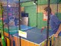 this is me playing a ping-pong game in an arcade in japan