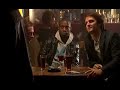 a dvd pirate sells his wares to a group of mates in a pub. they ask him for 