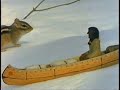 during the long winter night, a boy sets out to carve a man in a canoe. he calls the little man 