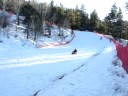 Marlon sledding down the mnt