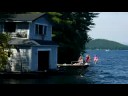 Maddie jumps off the boat-house ledge