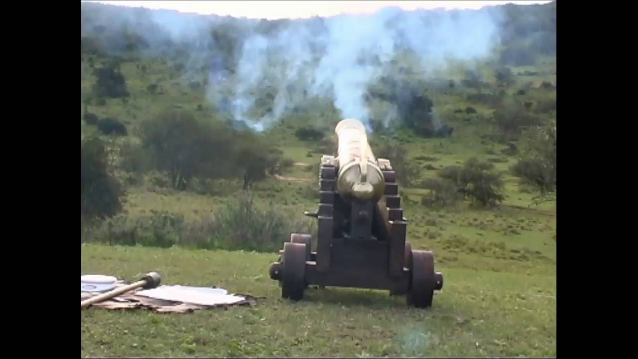 Bronze 1 pounder cannon firing over the hill