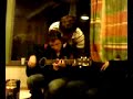 Finbarr singing and playing guitar