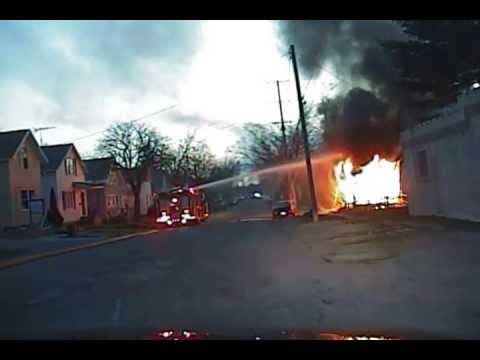 Pkwy - Structure fire in Manistee, shows initial responders and a flashover.