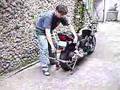 Dismounting rear motorcycle stand