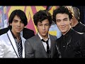 I'm sorry i couldn't upload before, but i'm REALLY busy this month, but now, its raining and i'm freezing cold, so i'm in a good mood. Enjoy!(Next day. Kevins p.o.v.)Nick and Joe are so lucky. They always get all the girls. Its not that Im mad or anything, Im happy for them, but it would be nice to have a girlfriend, you know. Nick is being stupid right now, I mean, he is hanging with that girl Melina, and let me tell you, shes bad news. And Joe, well, he is still Joe, and apparently he likes Leanna. Shes a nice girl, and shes goofy, so they are perfect for each other. Maybe soon, I will get a girlfriend. *sigh*(Normal p.o.v.)Claudia: *calling someone* Hello? Sandy?Sandra: Hey Claudia! Claudia: Hey! Are you still coming to L.A.?Sandra: Of course!Claudia: cool.Kevin: who was that?Claudia: my best friend. She loves you!Kevin: *happy* really?!Claudia: yep!Kevin: cool! When is she coming?Claudia: in about two weeks.Kevin: alright, can you introduce me to her when she comes?Claudia: sure!So a week went by, and Nick and Melina went out everyday. Claudia tried to ignore them, but it was so hard. Besides, Melina was always making her mad, insulting her, making fun of her, and all that.Claudia: AAAAHHHH!!! LEAVE ME ALONE!!!!Melina: NEVER!!! *pulls her hair*Claudia: OUCH!!! *pushes her*Melina: oh, no you didnt!Claudia: oh, yes I did!Nick: *coming in* whats going on?!Melina: Nicky, Claudia pushed me and screamed at me. *glares at Claudia*She was so fake, but apparently Nick was too blind to see that.Nick: I think you better go home.Claudia: what?! But I didnt do anything! Shes lying!Nick: just go.Claudia: but—Nick: GO!Claudia: *sad* I cant believe you!She went home crying. Her own best friend didnt believe her.Joe came in the room after that.Joe: whats with all the screaming?Nick: Claudia was bothering Melina.Melina: thanks for kicking her out, Nicky. Joe: you kicked her out? *disappointed*Melina: well, she was annoying.Joe: *to Melina* shut up, Im not talking to you!Nick: hey, dont talk to her like that.Joe: ugh, youre an idiot, you know that?Joe stormed off, and went to look for Claudia!He found her sitting on a bench. She was writing in a notebook. Her diary, maybe.Joe: heyClaudia: *looks up* hiJoe: you ok?Claudia: *nods*Joe: so what are you doing?Claudia: writing on my diaryJoe: coolAWKWARD SILENCEJoe: listen, dont mind nick, hes just too blind to see that you two belong together.Claudia: what makes you think we belong together?Joe: you like him and he likes you.Claudia: I do not like him!Joe: *gives her a look*Claudia: okmaybe a little.Joe: *smiles*Claudia: but I hate that girl MelinaJoe: that makes *counts his fingers* 5 of usClaudia: *laughs* what would I do without you, JoeyJoe: absolutely nothing, because Im *deep voice* SUPERMAN!Claudia: *laughs* riiightJoe: *hugs her*Claudia: thanks JoeJoe: youre welcome (With Nick)After Joe left, I decided to go for a walk. Melina wanted to come with me, but I told her I would see her tomorrow. I needed time to think.  Maybe I was too mean with Claudia. Why does everyone hate Melina! I mean, shes a nice girl, right? Well, shes nice when I am around, but when I go, theres always a fightmaybe everyone is right.No, stop it nick! Shes your girlfriend so you should be on her side. Nobody is going to change my mind. Leave a comment.Question of the day: Whos' the cutest couple. Nelena, Jaylor (not anymore ): ) or Kenielle.