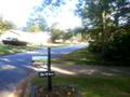 Down the hill.