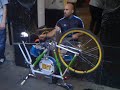 Man playing drums on bicycle