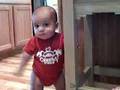noah waiving and standing on the chair