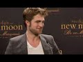 Robert Pattinson says New Moon takes a different look at love to Twilight  Kristen Stewart gets the reporters laughing . Follow us on twitter at twitter.com