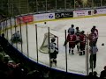 Hockey player taken down by linesman
