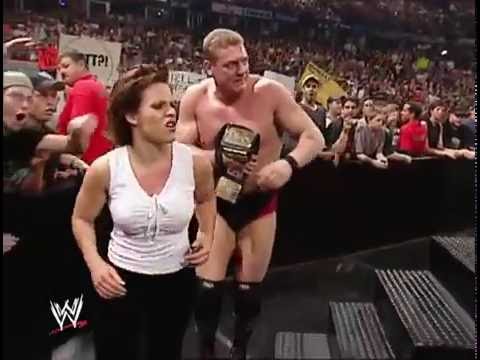 Molly Holly Decks Trish Stratus With Brass Knucks