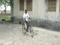 Amputee rides bicycle with new limb Amputee rides bicycle with new limb