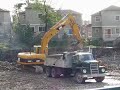 Cat 320C excavator and 1969 Dodge Dump truck