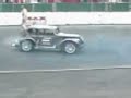 Guy tries to change a car tire while it\