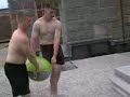 throwing a giant water balloon off a roof onto a port a pott