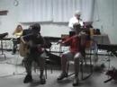 douglas cameron on fiddle and quinn bachand on guitar performing at the inverness ceilidh (cape breton), august 2007.