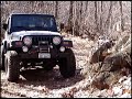 Jeep Rubicon flexing on a rock Jeep Rubicon flexing on a rock