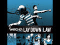 Lay Down The LawSwitchesLay Down The LawLyrics:Well she sure is cookin, cookin for meBut she caught me lookinAnd her mouth is ready, ready for meBut she caught me lookinWe lay down the law, so what the hell are you here for?We lay down the law, so what d'ya need me for?Well the door is open, open for meCos I caught her lookinAnd her lips are itchin, itchin for meCos I caught her lookinWe lay down the law, so what the hell are you here for?We lay down the law, so what d'ya need me for?Oooooh - OoooohOooooh - Oooooh - Yeah!We lay down the law, so what the hell are you here for?We lay down the law, so what d'ya need me for?