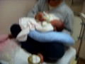 Enoch: Newly born baby on his dad's arm
