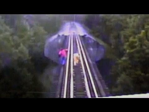 bridge - Two women narrowly escaped being killed when a train surprised them as they were walking along railway tracks on a bridge in Indiana Footage has been released of a terrifying incident where...