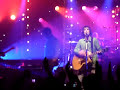 Liam Gallagher helping Richard Ashcroft on stage
