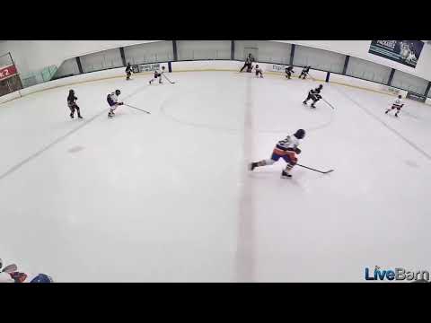 Liam wins his draw starting a rush down ice (Liam does drive to the net, leaving a drop pass for his teammate who scores)