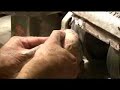 Rubbing down a large potch rough opal
