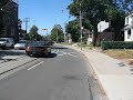 this video clip was taken on september 1, 2007 during my cycling trip to see the canadian international airshow which is always held on labour day weekend. i started in toronto's east end, cycled in on gerrard street through the colourful neighbourhoods of little india and toronto's eastern chinatown, both of which feature ethnic cuisine, vegetable, fruit and retail stores. then i crossed the don valley parkway and cycled by regent park, a public housing development from the 1950s and 1960s which has experienced significant social problems in the last few decades. a portion of regent park has been demolished to make way for a brand-new mixed housing development that will include low-income housing as well as middle-income housing. right across the street from regent park is cabbagetown, a neighbourhood that was originally settled by irish immigrants that started to be settled as early as the late 1840s after a wave of poor immigrants left ireland due to the irish potato famine. these poor residents grew cabbage in their front yards, hence the name cabbagetown. in the last few decades cabbagetown has become increasingly popular and has seen  extensive gentrification.
 
i cycled through the relatively poor downtown east side to the intersection of gerrard and yonge; yonge street is the east-west dividing line in toronto and used to be the longest street in the world. i then continued west on college street, past queen's park and the university of toronto to the intersection of college and dundas, the northern end of toronto's chinatown. further west i reached little italy, one of toronto's most popular entertainment areas, where the streets were block off for the fiera festival. all the restauranteurs and merchants were still setting up shop around noon time, although the streets were already starting to get busy. i continued west on college street to the beautiful high park residential neighbourhood between roncesvalles and keele street, and then headed into toronto's largest urban park - high park. i visited the jamie bell adventure playground, took inventory of the animals in the high park zoo (e.g. yaks, western highland cattle, peacocks, emus, lamas, and a whole family of bisons including two young bison offspring) and then headed to the central plateau of high park that features beautiful views over the maple leaf next to grenadier pond and offers culinary treats to the visitors at the grenadier restaurant.
 
overhead i could already hear the supersonic boom of the jet fighters that were doing mid-air acrobatics as part of the canadian international air show, an annual labour day event. to see the planes i cycled down to toronto's waterfront and relaxed for a while in the sand at sunnyside beach, watching a parade of airplanes from different eras perform all sorts of aerobatics. i then continued further east towards ontario place where tens of thousands of people had set up camp to watch the air show. the canadian national exhibition was in full swing as well. i made may way east, and on my way towards harbourfront i stopped at the historic tiptop tailors building, a former garment factory turned recently into a loft condominium conversion - an art deco jewel with beautiful ornamentation. further east, at the foot of bathhurst street, next to the abandoned canada malting plant, i stumbled across ireland park, a memorial to 38,000 irish immigrants who fled ireland during the potato famine of 1847 to escape extreme conditions of hunger and settle in a new continent. the scultpures in this park provide a gripping depiction of these emigrants' experiences. figures such as the orphan boy and the apprehensive man illustrate the horrors of this period. the park itself is a symbol of canadian-irish collaboration. my last stop on my nearly 50 km cycling tour was the toronto music garden, a beautiful stretch of greenery in the concrete jungle of harbourfront that offers a welcome respite from the city's condo towers. i safely made it home after a nice ride through toronto's eastern beaches. 

i am actually a travel writer who loves to explore international destinations as well as my chosen home town of toronto. on youtube you will find hundreds of video clips from a wide variety of destinations. feel free to check out some of my 700+ articles and interviews on http//www.travelandtransitions.com. my personal travel stories are located at http://www.travelandtransitions.com/stories_photos.htm and my austrian travel articles will be published in the next few weeks.

also, my free travel ebooks containing stories from my trips to destinations such as sicily, havana, mexico city, new york city, chicago, florida, toronto, montreal, ottawa, vancouver, halifax and many others are available right now at http://www.travelandtransitions.com/ebooks.html.