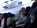 Goofy kid trying to sleep on the plane