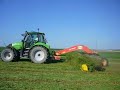 Andainage de la luzerne avec un Roc de 9.5 m et un Deutz Andainage de la luzerne avec un Roc de 9.5 m et un Deutz
