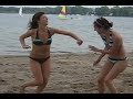 Just a couple girls fake fighting on a beach. What more could you want?