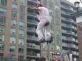 Toronto - Buskerfest - Dynamike jumps on elevated unicycle