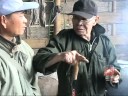 Prof. Akio Ujihara, buckwheat commander, gives lecture to Kokang counterpart of buckwheat project, Mr. Sai Aung Myint at Heho village near Siao, Laukai. A local farmer tried to distill buckwheat alcohol so called 
