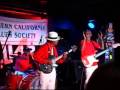 chu chu and the lovely band on stage at the cellar in long beach, california: chu chu, guitar; glen doll, harmonica; buddy 