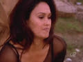 a video clip of sydney fox (tia carrere) dressing in the episode 