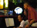 Ome Cor's karaoke act in Suphan Buri, Thailand