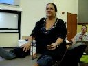 lisa in class during a break talking to boyle