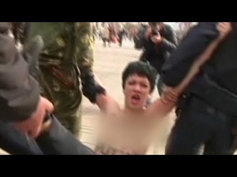 Topless protester rails against Putin